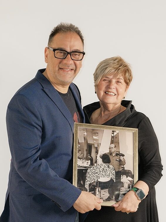 Carmen, Mom Rosetta, with photo of Dad Carmelo